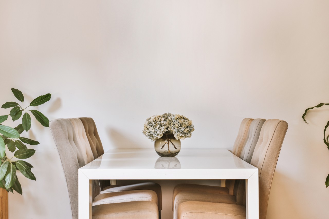 minimalist table with flower vase on top